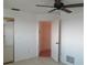 Simple bedroom with tile floors, a mirrored closet door, and natural light at 334 Dante Dr # 334, Nokomis, FL 34275