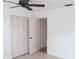 Simple bedroom showing double closets and neutral colors at 334 Dante Dr # 334, Nokomis, FL 34275