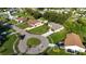 A residential street featuring well-maintained lawns and diverse single-Gathering homes at 3588 Erie Ct, North Port, FL 34287