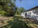 A serene backyard with lush greenery and ample space for outdoor activities at 3588 Erie Ct, North Port, FL 34287