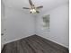 Bedroom featuring gray wood flooring, a ceiling fan, and natural lighting at 3588 Erie Ct, North Port, FL 34287