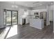 Beautiful kitchen featuring stainless steel appliances, a chandelier, and a central island at 3588 Erie Ct, North Port, FL 34287