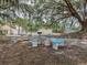 Community picnic area with tables, benches, grill and large shade trees at 3588 Erie Ct, North Port, FL 34287