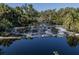 Tranquil pond view with lush vegetation along the banks, creating a serene natural setting at 3588 Erie Ct, North Port, FL 34287