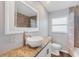 Updated bathroom offers granite counters, a vessel sink, and a tiled shower at 3616 Lalani Blvd, Sarasota, FL 34232