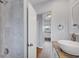 Renovated bathroom features granite counters, tiled walls, and modern fixtures at 3616 Lalani Blvd, Sarasota, FL 34232