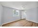 Cozy bedroom featuring a ceiling fan, new floors, and natural lighting at 3616 Lalani Blvd, Sarasota, FL 34232