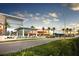 View of a modern retail center featuring sleek architecture, ample parking, and well-maintained landscaping at 3616 Lalani Blvd, Sarasota, FL 34232