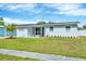 Inviting single-story home with fresh exterior paint, a green lawn, and tasteful landscaping for enhanced curb appeal at 3616 Lalani Blvd, Sarasota, FL 34232
