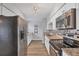 Modern kitchen equipped with stainless steel appliances, granite countertops, and white cabinetry for a clean, updated feel at 3616 Lalani Blvd, Sarasota, FL 34232