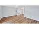 Expansive open-concept living area featuring wood floors and neutral walls, providing a versatile space for various furnishings at 3616 Lalani Blvd, Sarasota, FL 34232