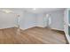Open living space featuring wood floors, neutral walls, and a smooth transition to adjacent rooms, offering a modern touch at 3616 Lalani Blvd, Sarasota, FL 34232
