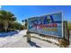 Sign near a sandy path leading to the #1 beach in the USA, Siesta Beach, under a clear sky at 3616 Lalani Blvd, Sarasota, FL 34232