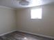 Bright bedroom area with wood-look floors, white trim, and a fan fixture at 373 Longwood Dr, Venice, FL 34285