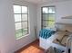 Sunlit laundry area with washer, dryer, shelving and a window offering views of the property at 373 Longwood Dr, Venice, FL 34285