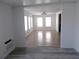 Bright living room area with plenty of natural light and wood-look floors throughout the house at 373 Longwood Dr, Venice, FL 34285