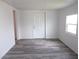 Living area with modern flooring, neutral walls and bright natural light at 373 Longwood Dr, Venice, FL 34285
