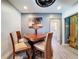 Cozy dining area showcasing a unique table, modern lighting, and access to the bathroom at 413 Valencia Rd, Venice, FL 34285