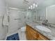 Modern bathroom featuring a glass-enclosed shower, vanity with granite top, and sleek fixtures at 418 Cerromar Ct # 158, Venice, FL 34293