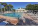 Community pool features crystal clear water, lounge chairs, and a clubhouse for residents' leisure and recreation at 418 Cerromar Ct # 158, Venice, FL 34293