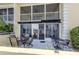 Rear exterior showcasing multiple lanais with seating areas, perfect for outdoor enjoyment and relaxation at 418 Cerromar Ct # 158, Venice, FL 34293