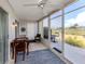Cozy lanai with outdoor seating, offering peaceful views of the surrounding golf course at 418 Cerromar Ct # 158, Venice, FL 34293