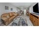Inviting living room features stylish furnishings, a large TV, and bright, airy ambiance at 418 Cerromar Ct # 158, Venice, FL 34293
