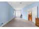 Spacious bedroom with a ceiling fan, carpet flooring, and access to a private balcony at 4378 Summertree Rd, Venice, FL 34293