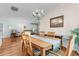 Elegant dining room with hardwood floors and an adjacent living area at 4378 Summertree Rd, Venice, FL 34293