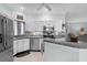 Bright and modern kitchen with stainless steel appliances, white cabinets, and granite countertops at 4378 Summertree Rd, Venice, FL 34293