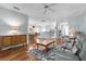 Open-concept living area with hardwood floors and view of the kitchen and dining space at 4378 Summertree Rd, Venice, FL 34293