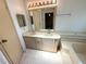 Bathroom with double sink vanity, tile flooring, and soaking tub at 453 Sharks Pt, North Port, FL 34287