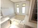 Bathroom features soaking tub, tile flooring, and updated fixtures at 453 Sharks Pt, North Port, FL 34287