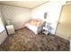 Bedroom featuring daybed, wicker furniture, and a large window at 453 Sharks Pt, North Port, FL 34287