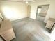 Simple bedroom featuring carpet, ceiling fan, and closet with mirrored doors at 453 Sharks Pt, North Port, FL 34287