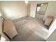 Bedroom with large closet with mirrored doors and neutral carpet at 453 Sharks Pt, North Port, FL 34287
