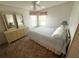 Bedroom with large bed, dresser with mirrors, and coordinated decor at 453 Sharks Pt, North Port, FL 34287