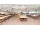 Community center featuring a dance floor, stage, tables and chairs for gatherings and events at 453 Sharks Pt, North Port, FL 34287