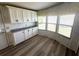 Bright dining area with ample natural light from multiple windows and built-in cabinets at 453 Sharks Pt, North Port, FL 34287