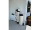 Water filtration system situated outside near some flowering bushes at 453 Sharks Pt, North Port, FL 34287