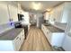 Updated kitchen with granite countertops, stainless steel appliances and eat in dining area at 453 Sharks Pt, North Port, FL 34287