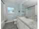Well-lit bathroom featuring a granite countertop and a bathtub with modern fixtures at 460 Bard Rd, Venice, FL 34293