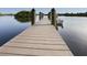 Beautiful private dock with boat access on tranquil water perfect for peaceful waterfront living at 460 Bard Rd, Venice, FL 34293
