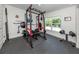 Exercise room, offering the perfect space for weight training, with padded floors and a view to the outdoors at 460 Bard Rd, Venice, FL 34293