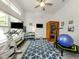 Bright exercise room with a sauna, television, and bike, providing a space for fitness and relaxation at 460 Bard Rd, Venice, FL 34293