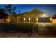 Inviting single-story home with a well-manicured lawn, covered entryway, and attached garage at 460 Bard Rd, Venice, FL 34293