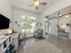 Inviting home office featuring wood-look floors, natural light, and a comfortable recliner at 460 Bard Rd, Venice, FL 34293