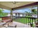 Relaxing balcony with comfortable seating and a lovely view of the community at 4646 Longwater Chase # 98, Sarasota, FL 34235