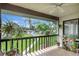 Enjoy a pleasant view of the community pool from this lanai with plants and a ceiling fan at 4646 Longwater Chase # 98, Sarasota, FL 34235