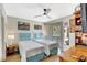 Comfortable bedroom featuring two twin beds, ceiling fan and natural light at 4646 Longwater Chase # 98, Sarasota, FL 34235